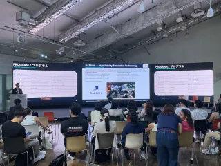 Audience and program screen at Tokyo Innovation Base