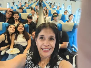 Guatemalan participants traveling together aboard a Shinkansen